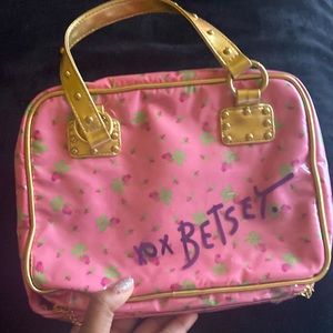 Two sided makeup bag with handles.